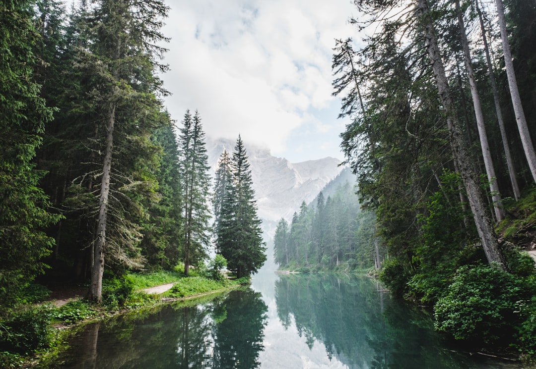 Tranquil lake reflecting mountain peaks